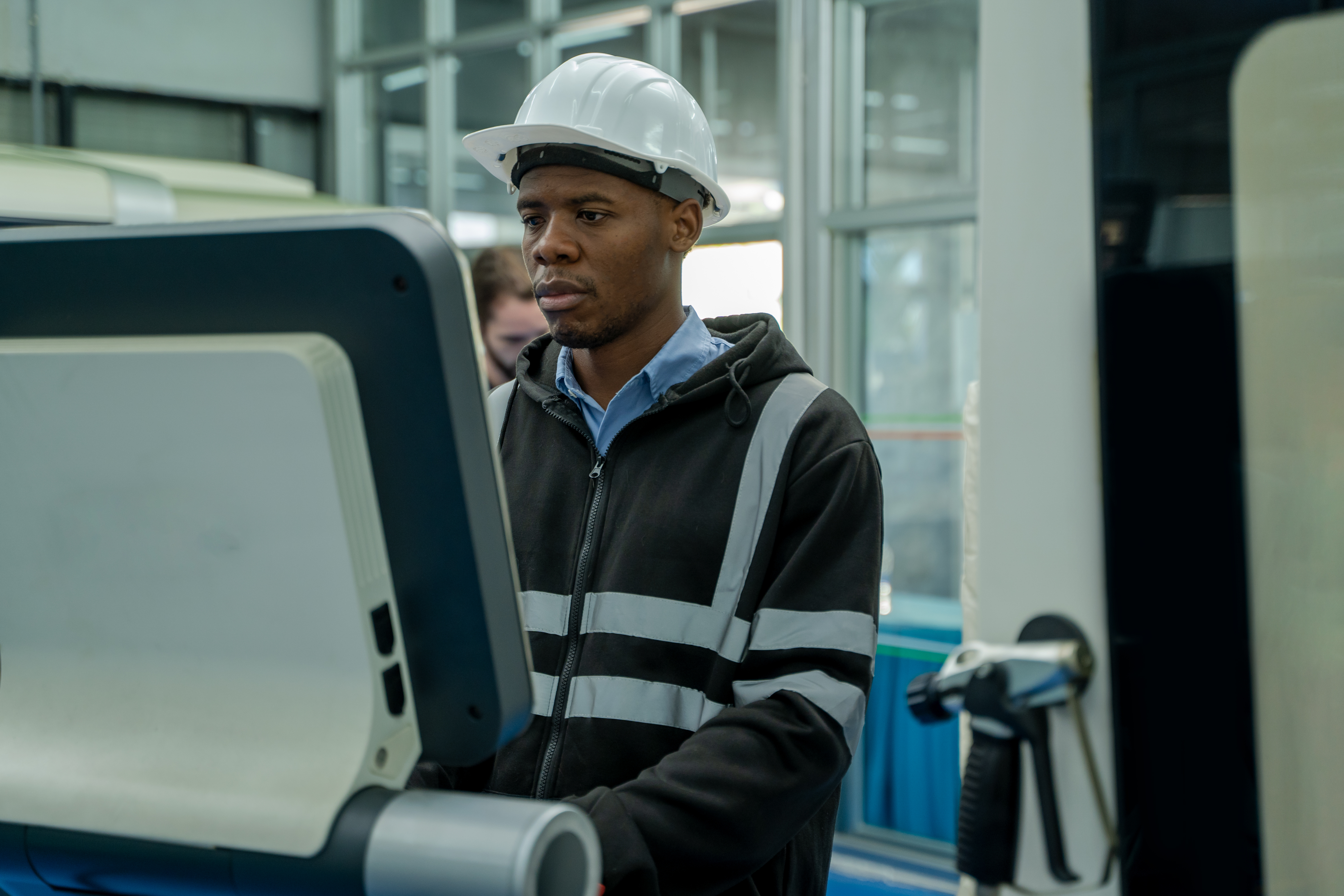 engineer-use-digital-tablet-controller-in-factory-2023-11-27-05-36-04-utc